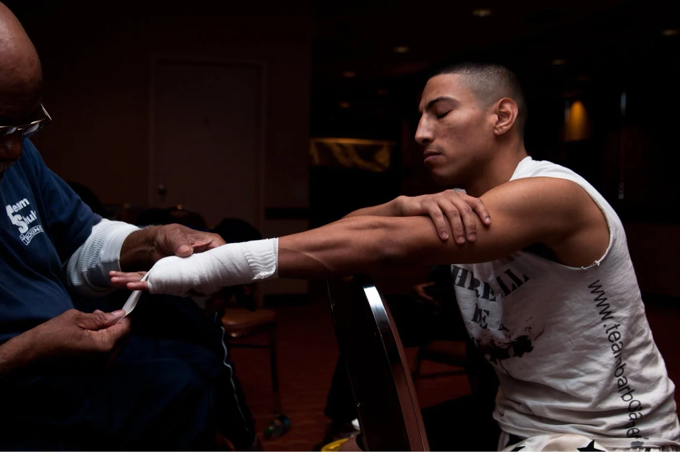Boxer having a hand wrapped before training or competition