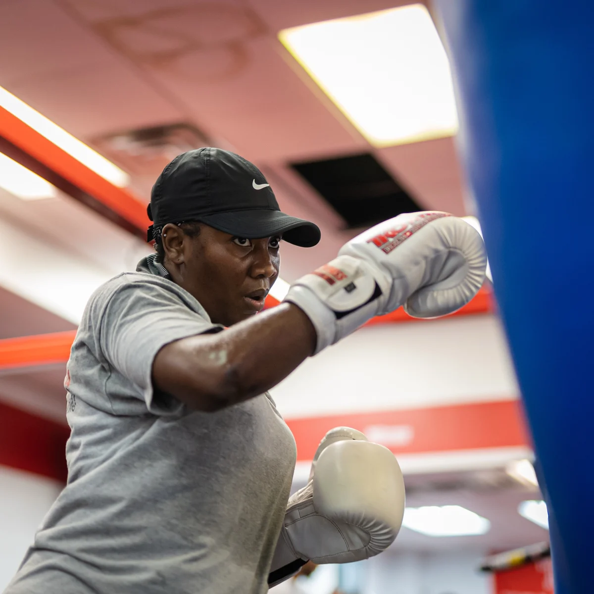Boxer practicing a punch on a heavy bag at TKO