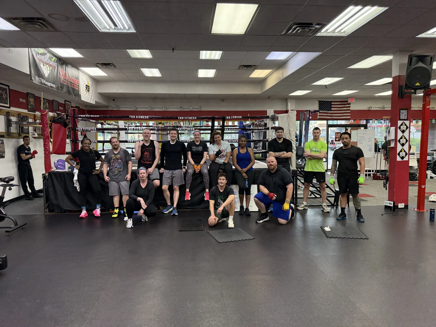 TKO Fitness members together in front of the boxing ring